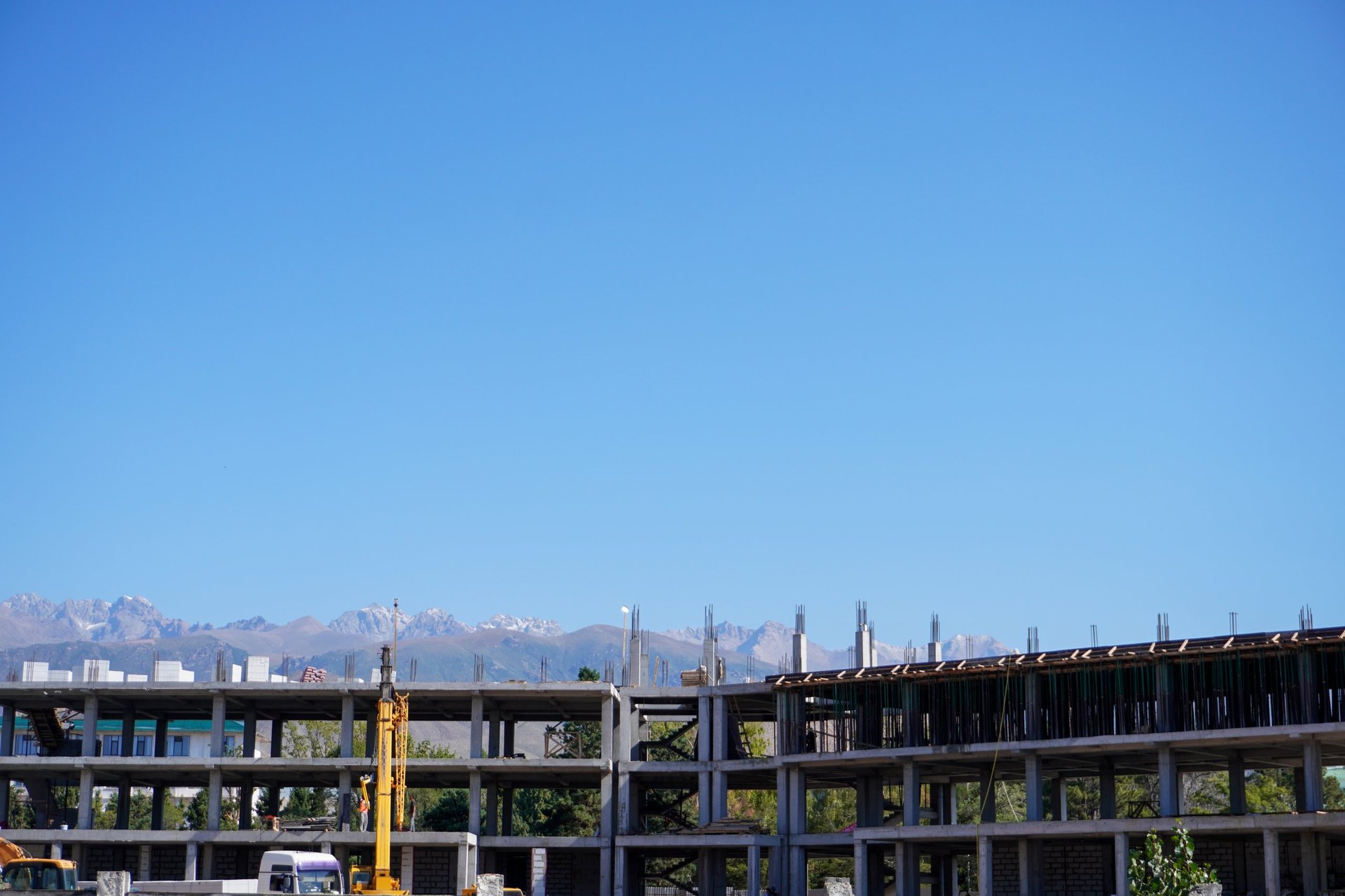 Colorado mountain range with construction site in foreground